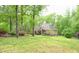 Beautiful brick home with mature trees and greenery offering a sense of privacy and tranquility at 14 Whit Ct, Angier, NC 27501