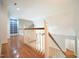 Open hallway with hardwood floors, white trim, a built-in bookcase, and natural light at 14 Whit Ct, Angier, NC 27501