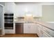 Well-equipped kitchen showcasing stainless steel appliances, sleek countertops, and ample cabinet space at 14 Whit Ct, Angier, NC 27501