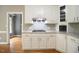 The kitchen offers white cabinets, granite counters, gas cooktop, and stainless steel vent hood at 14 Whit Ct, Angier, NC 27501