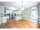 Bright kitchen with white cabinets, stainless steel appliances, and a breakfast bar with seating at 14 Whit Ct, Angier, NC 27501