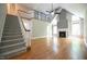Bright living room with vaulted ceilings, fireplace, and staircase leading to the loft area at 14 Whit Ct, Angier, NC 27501