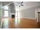 Spacious living room with hardwood floors, fireplace, large windows, and lots of natural light at 14 Whit Ct, Angier, NC 27501