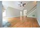 Spacious living room with hardwood floors, vaulted ceiling, and staircase leading to upper level at 14 Whit Ct, Angier, NC 27501