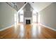 Spacious living room with vaulted ceilings, fireplace, hardwood floors, and many windows at 14 Whit Ct, Angier, NC 27501