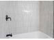 Updated bathroom with white subway tile in shower and black matte shower head and faucet at 1514 Goodwin Rd, Durham, NC 27712
