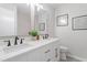 Bathroom with double vanity, modern fixtures, and decorative wall art at 1514 Goodwin Rd, Durham, NC 27712