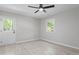Bedroom featuring a door to the back yard and a window that provides abundant natural light at 1514 Goodwin Rd, Durham, NC 27712