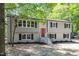 Charming two-story home with a bright red front door and beautifully landscaped front yard at 1514 Goodwin Rd, Durham, NC 27712