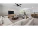 Open-concept living area with stylish seating and an adjacent dining space at 1514 Goodwin Rd, Durham, NC 27712