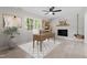 Charming office featuring a fireplace and large desk with natural light at 1514 Goodwin Rd, Durham, NC 27712
