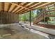 View of unfinished basement-level patio and staircase leading to the yard at 1514 Goodwin Rd, Durham, NC 27712