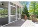 Outdoor screened-in porch featuring a ceiling fan, a deck and a view to the yard at 1514 Goodwin Rd, Durham, NC 27712