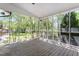 Spacious screened-in porch with views of the surrounding trees at 1514 Goodwin Rd, Durham, NC 27712
