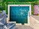 Aerial view of a private backyard basketball court, complete with a full court and surrounding landscaped backyard at 16 Portofino Pl, Durham, NC 27707