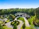 Magnificent aerial of estate showcasing fountain pond, circular driveway, and lush greenery at 16 Portofino Pl, Durham, NC 27707