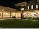 Lush backyard featuring a covered patio with ample lighting and a view into the home at 16 Portofino Pl, Durham, NC 27707