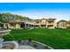 Expansive backyard featuring a water fountain and manicured lawns at 16 Portofino Pl, Durham, NC 27707
