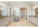 Beautiful bathroom with granite countertops, double vanity, and makeup vanity at 16 Portofino Pl, Durham, NC 27707