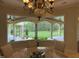 The dining room overlooks the landscaped backyard through a large bay window at 16 Portofino Pl, Durham, NC 27707