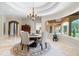 Well-appointed dining area with a view of the landscaped outdoor space at 16 Portofino Pl, Durham, NC 27707