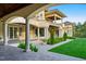 Stunning two-story home featuring a beautiful stone patio and manicured lawn at 16 Portofino Pl, Durham, NC 27707