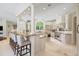 Spacious kitchen featuring custom cabinetry, granite counters, and a breakfast bar at 16 Portofino Pl, Durham, NC 27707