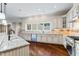 Well-appointed kitchen with stainless steel appliances, granite countertops, and tile backsplash at 16 Portofino Pl, Durham, NC 27707