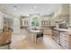 Gourmet kitchen with an island, custom cabinets, granite countertops, and stainless steel appliances at 16 Portofino Pl, Durham, NC 27707