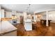 Open concept kitchen with granite countertops, stainless steel appliances, and breakfast bar at 16 Portofino Pl, Durham, NC 27707