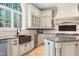 Beautiful kitchen featuring custom cabinets, an island and modern appliances at 16 Portofino Pl, Durham, NC 27707