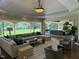 Open living room with large windows and an elegant outdoor view at 16 Portofino Pl, Durham, NC 27707