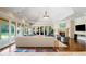 Beautiful living room with fireplace, hardwood floors, and large windows at 16 Portofino Pl, Durham, NC 27707