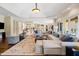 A spacious living room featuring neutral decor and a luxurious fireplace at 16 Portofino Pl, Durham, NC 27707