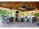 Inviting outdoor space featuring a fireplace, kitchen and outdoor seating at 16 Portofino Pl, Durham, NC 27707
