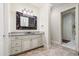 Charming powder room featuring custom vanity and granite countertop at 16 Portofino Pl, Durham, NC 27707