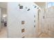 Luxurious shower with multiple shower heads and controls at 16 Portofino Pl, Durham, NC 27707