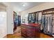Large walk-in closet with custom shelving, drawers, and hanging space at 16 Portofino Pl, Durham, NC 27707