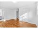 Bright bedroom with hardwood floors and attached bathroom at 1751 Riverside Dr, Hillsborough, NC 27278