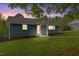A cozy home with a welcoming entrance, lush lawn, and neat landscaping at 1751 Riverside Dr, Hillsborough, NC 27278