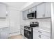Modern kitchen featuring stainless steel appliances and white subway tile backsplash at 1751 Riverside Dr, Hillsborough, NC 27278