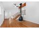 Open living area with hardwood floors, fireplace, staircase, creating a cozy and inviting atmosphere at 1751 Riverside Dr, Hillsborough, NC 27278