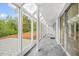 Bright sunroom featuring a tiled floor, glass enclosure, and a view of the outdoors at 1751 Riverside Dr, Hillsborough, NC 27278