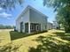 Exterior view of home's rear showcases a spacious backyard and modern siding at 177 Kipling Creek Dr, Fuquay Varina, NC 27526