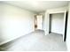 A bedroom with a closet and neutral decor offers a versatile space at 177 Kipling Creek Dr, Fuquay Varina, NC 27526
