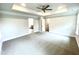 Large bedroom with modern gray carpeting and an ensuite bathroom at 177 Kipling Creek Dr, Fuquay Varina, NC 27526