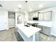 Kitchen with island, stainless steel appliances, shaker cabinets and quartz countertops at 177 Kipling Creek Dr, Fuquay Varina, NC 27526