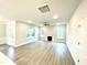 Spacious living room features hardwood floors, a fireplace, and plenty of natural light at 177 Kipling Creek Dr, Fuquay Varina, NC 27526