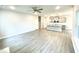 Open concept living room and kitchen area with ceiling fan and lots of natural light at 177 Kipling Creek Dr, Fuquay Varina, NC 27526