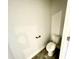 Powder room with tile flooring and an elongated toilet at 177 Kipling Creek Dr, Fuquay Varina, NC 27526